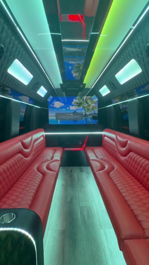 Red lounge seating and ambient lighting inside the ONWARD Sprinter