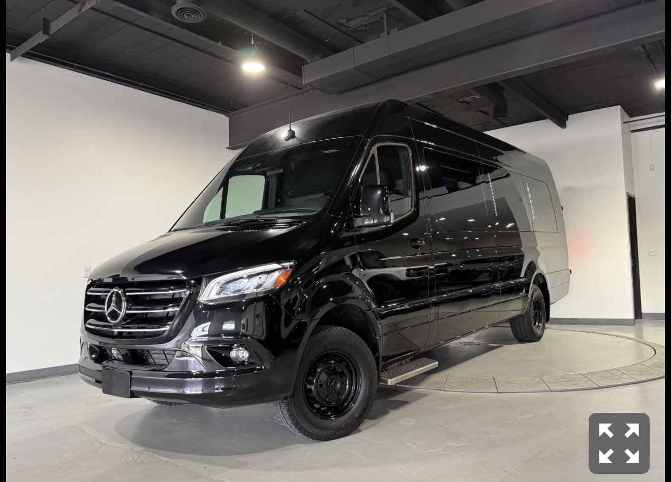 ONWARD's black Mercedes-Benz Sprinter in the showroom